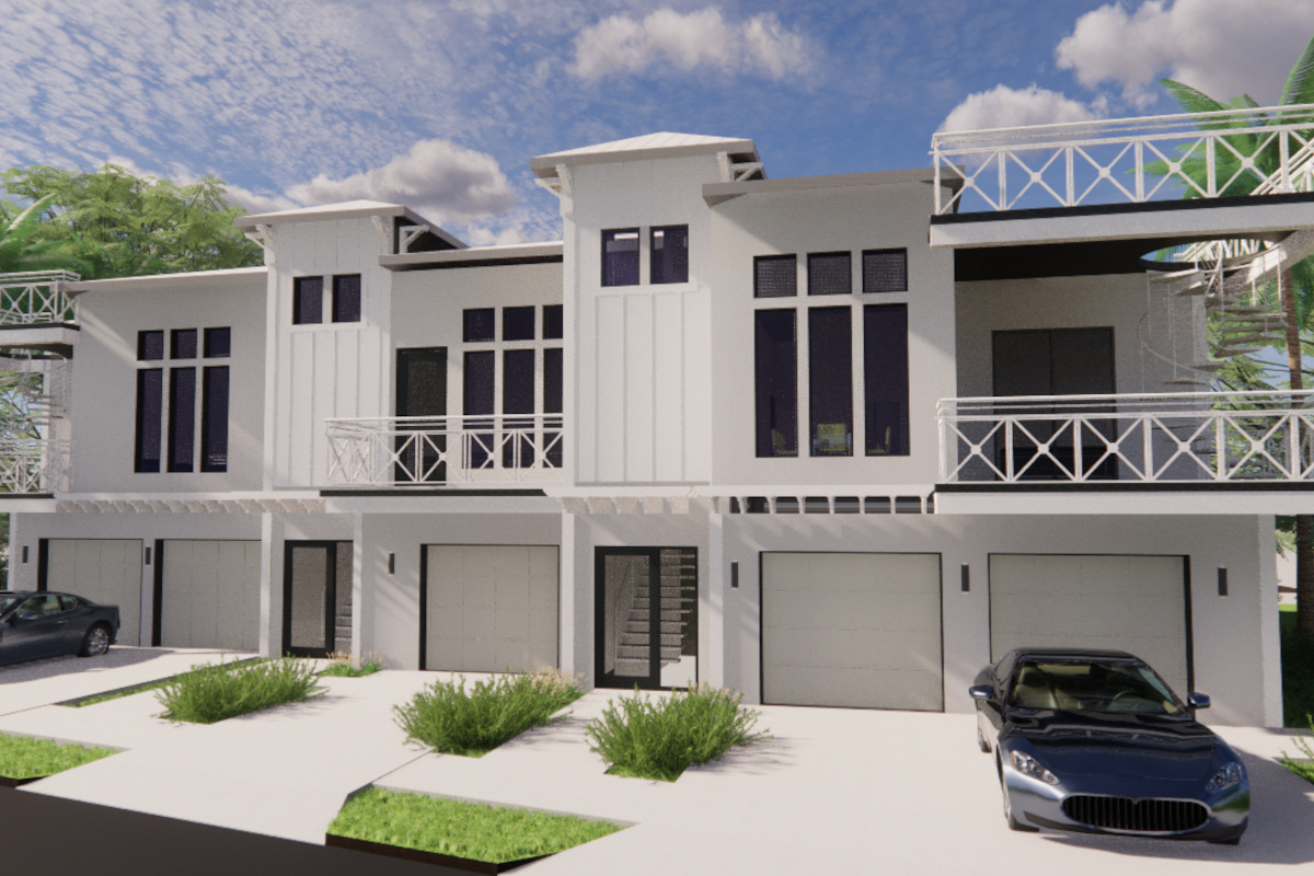 Image of three unit modern coastal townhomes with white walls and black trim details